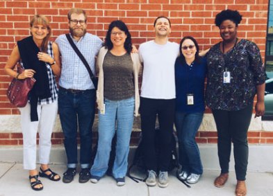 Picture of a line of people with smiling for a photo